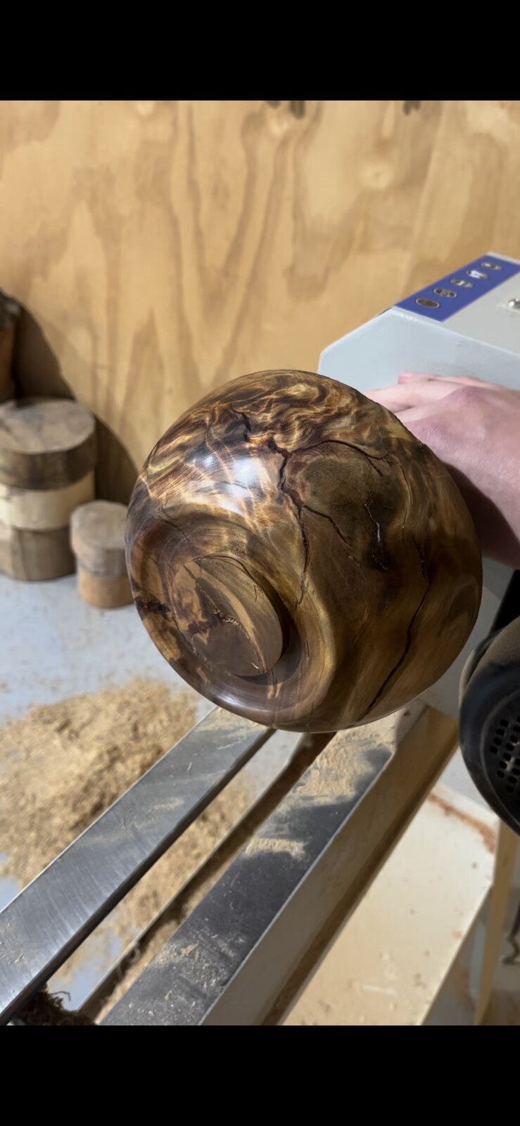 Wood-turned bowl taking shape on the lathe